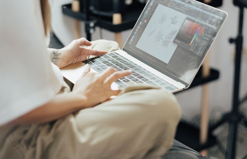 woman editing on laptop