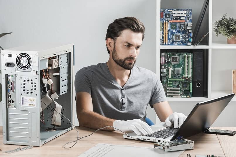 Technician checking computer