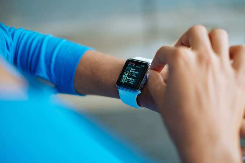 girl setting her smart watch