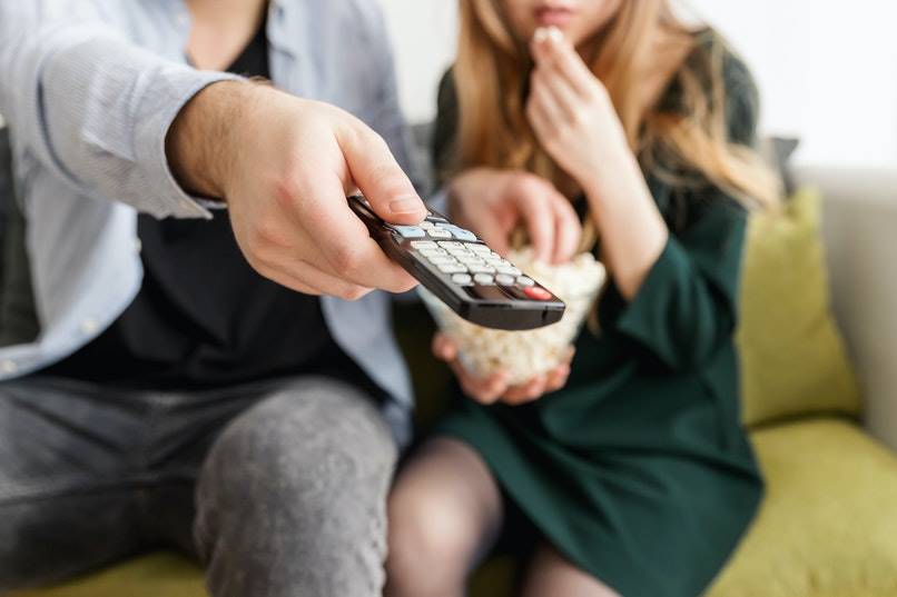 person using the remote