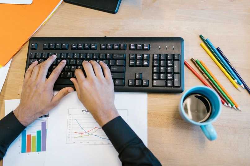 person typing on keyboard