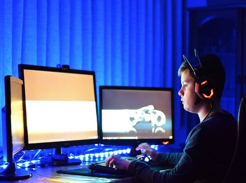 boy playing on his computer