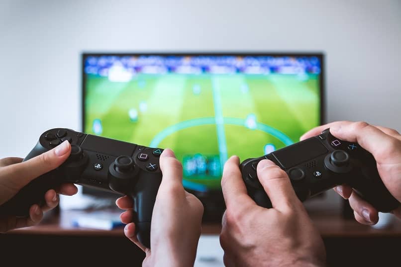 man playing video game with remote control