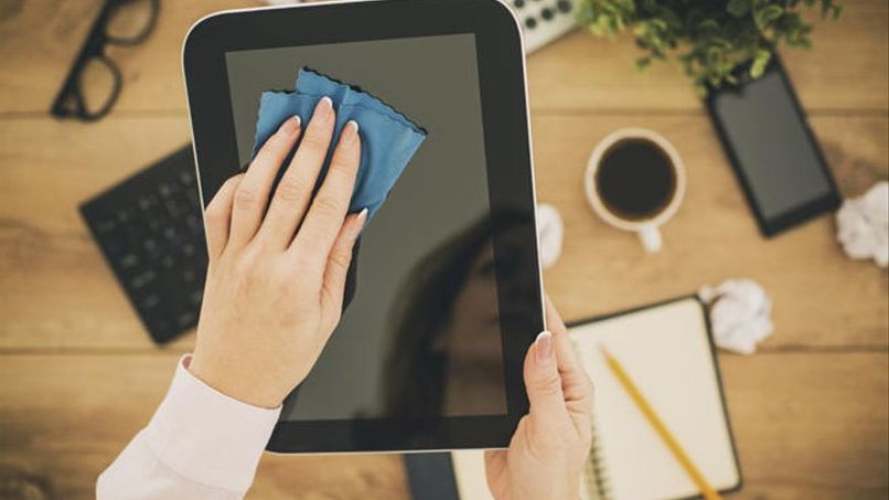 clean the ipad screen with a microfiber cloth