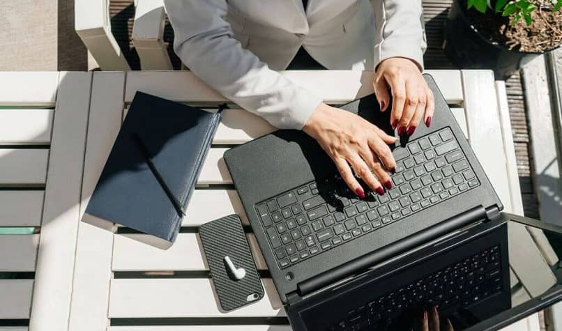 woman working with computer outdoors