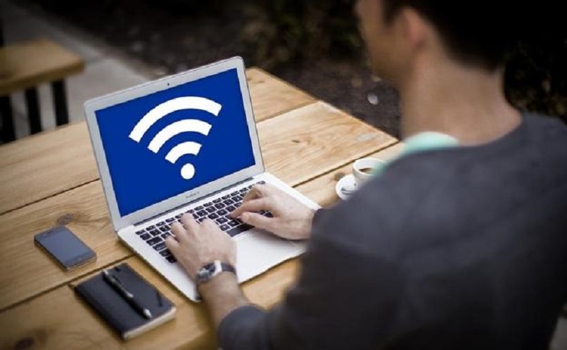 man evaluating wifi sign on his computer