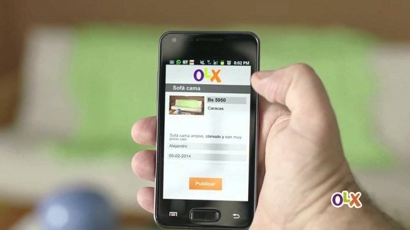 man using olx on mobile