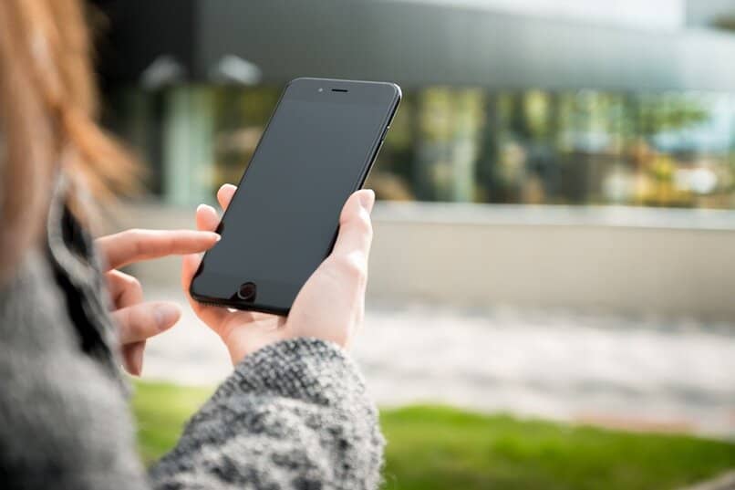 woman holding mobile phone