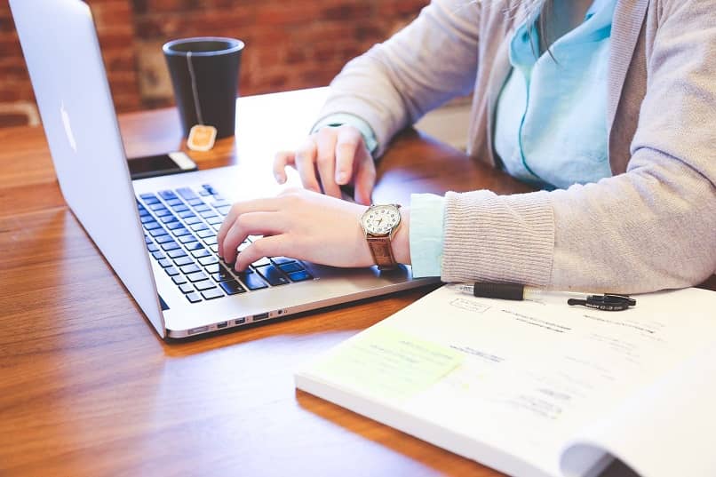 woman typing on computer