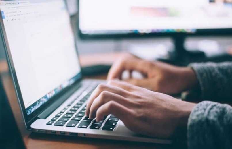 Hands of people using Windows 10 computer