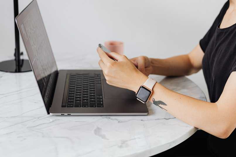 girl using mobile phone and computer