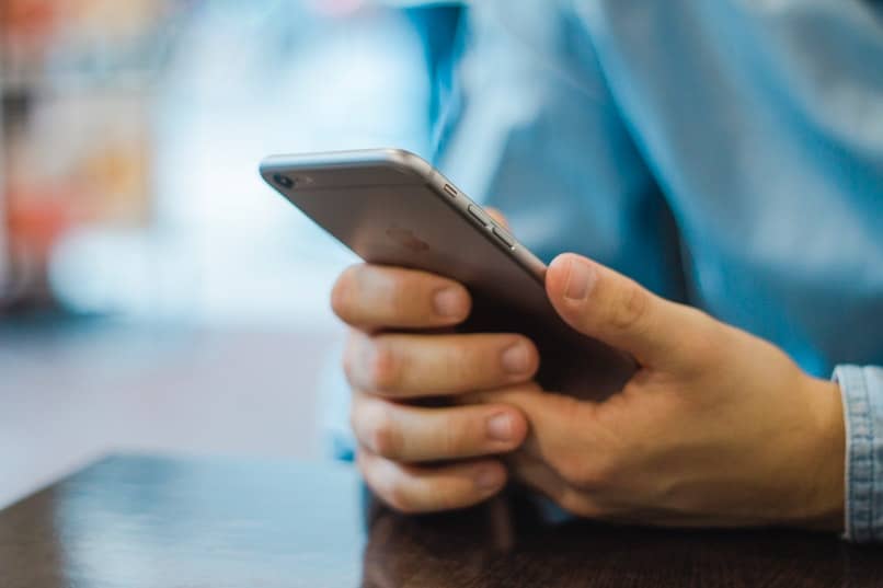 man checking cell phone