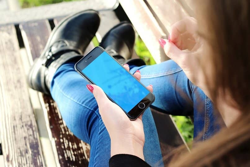 man using mobile phone outdoors